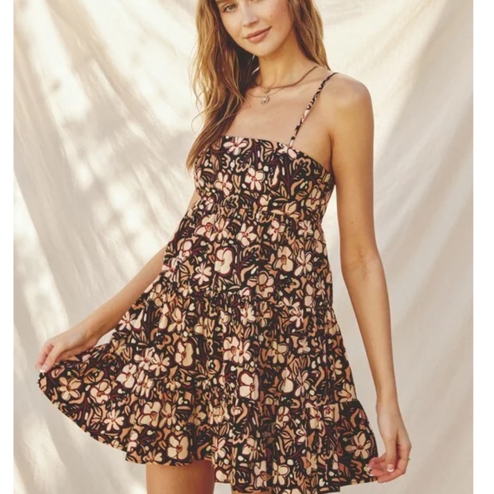 NWT Babydoll bodice with a tiered A line skirt and crossed back.